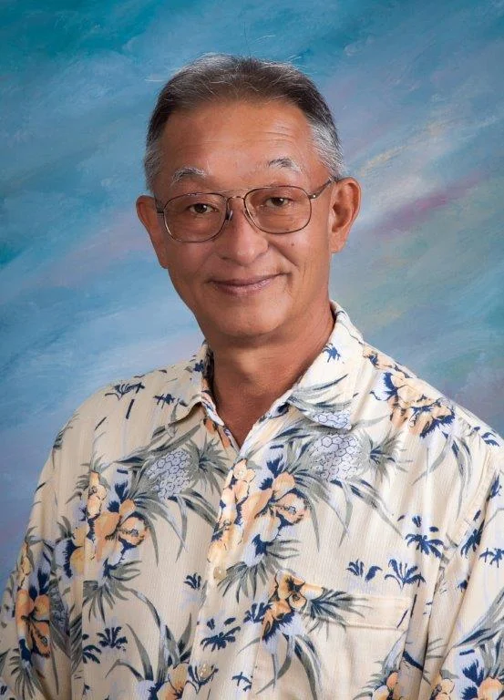 Mark K. Tanaka, REALTOR, wearing a tropical-print aloha shirt